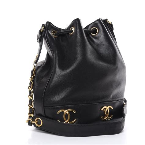 black leather chanel bag with drawstring closure|Chanel lambskin bag.